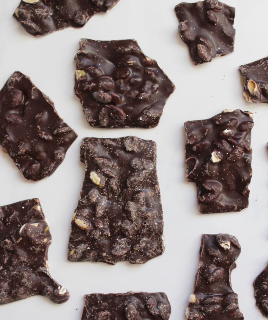 Dark chocolate candy bark with fresh pumpkin seeds