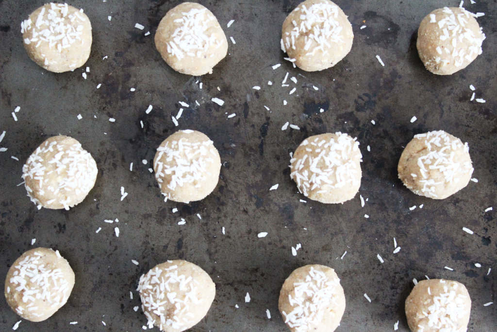 Round apple pie protein balls on a baking sheet