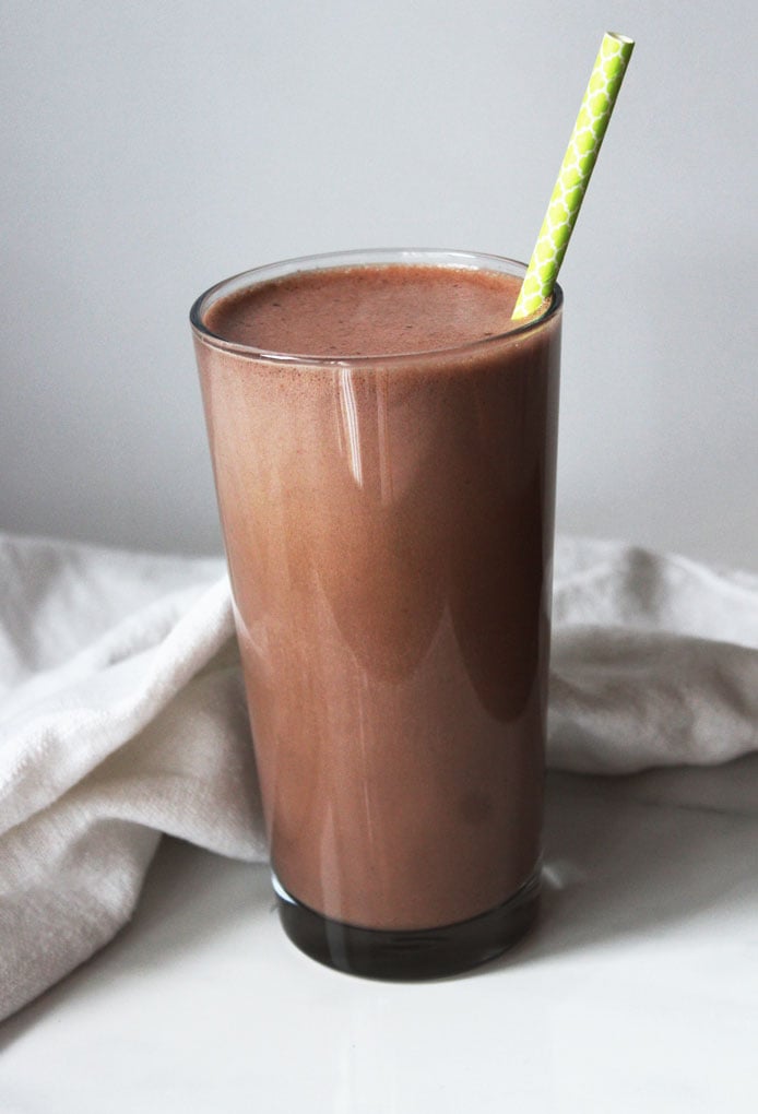 Single tall glass of a pure chocolate shake. Packed with protein with hemp powder and naturally sweetened with medjool dates. Dairy Free and Gluten Free