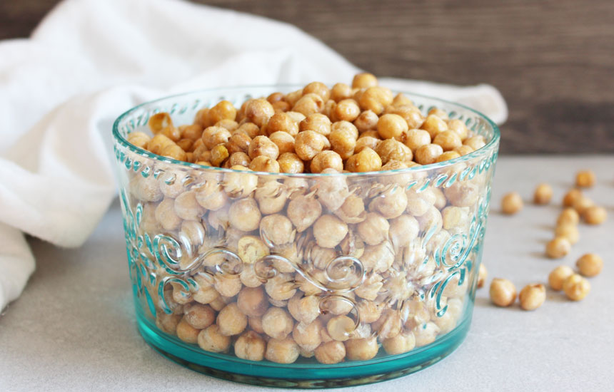 Roasted Salt and Vinegar Chickpeas with some fallen on table