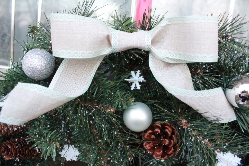 The theme of this DIY Christmas Wreath is white and silver to match my other Christmas decor