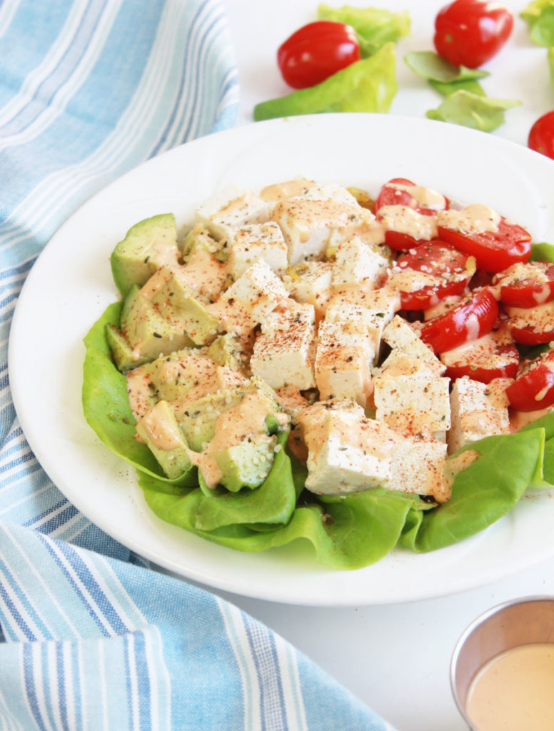 This vegan buddha bowl is packed with delicious flavor from the seasoned tofu and tahini sriracha dressing