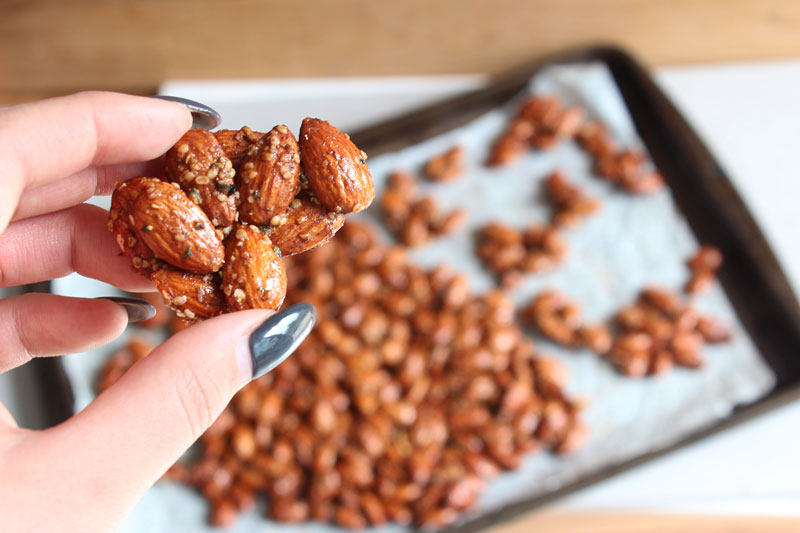 Holding cluster of Honey and Hemp Roasted Almonds - gluten free and dairy free snack dessert sweet treat www.nikkisplate.com