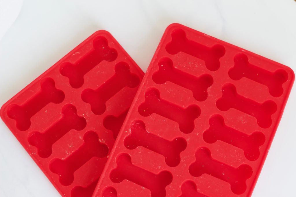 Use silicone dog treat molds to make these delicious peanut butter and pumpkin dog treats