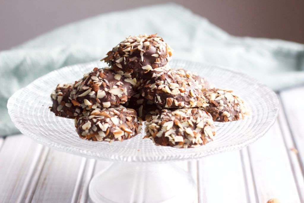 Soft and chewy chocolate cookies are dipped in creamy chocolate and coated with chopped chestnut pieces