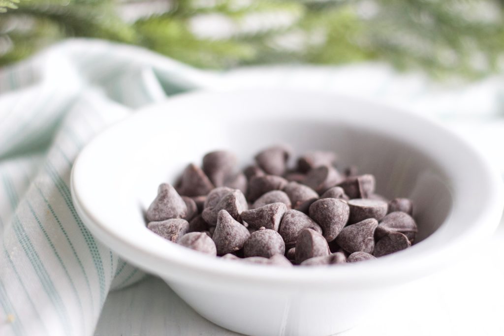 Gluten Free Chocolate Dipped Gingersnaps || bowl of dark chocolate chips || Nikki's Plate by Nikki Bahan