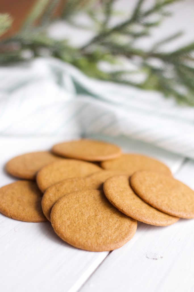 Gluten Free Chocolate Dipped Gingersnaps || Pile of round golden gingersnaps, Christmas baking, cookies.|| Nikki's Plate by Nikki Bahan