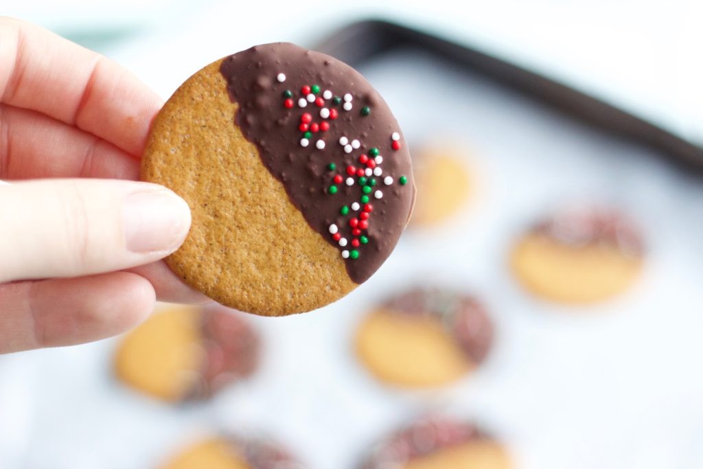 Gluten Free Chocolate Dipped Gingersnaps || Healthy gluten free and dairy free Christmas gingersnap cookie dunked in dark chocolate with red and green sprinkles || Nikki's Plate by Nikki Bahan