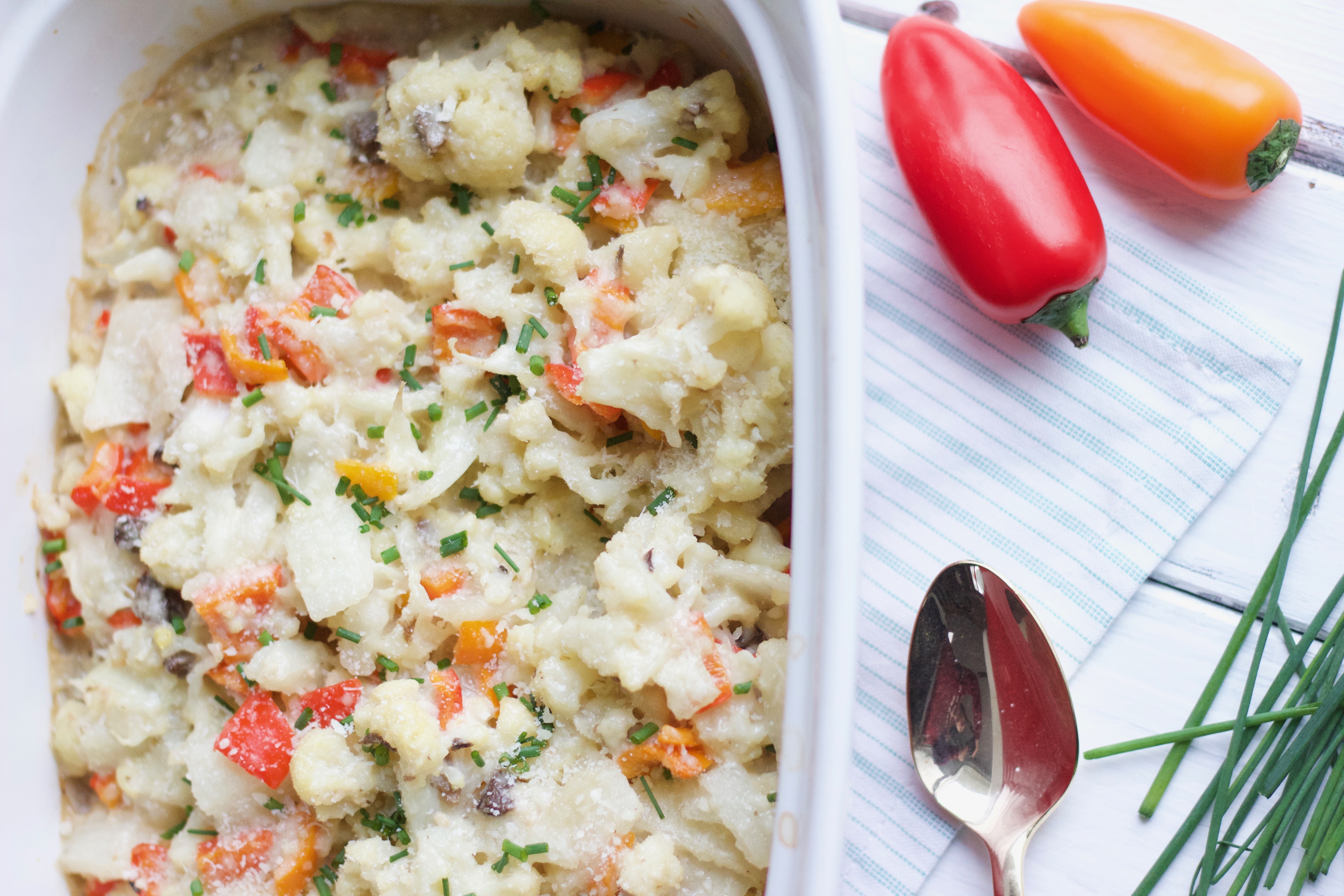 Creamy Cauliflower Bake with Tribelli Peppers a vegan and gluten free warm dinner dish that is bursting with pepper colours. Comfort food for any season! - www.nikkisplate.com