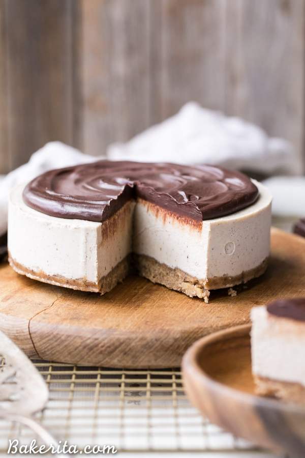 THis no-bake vegan vanilla bean cheesecake is topped with a dairy-free chocolate ganache that's rich and creamy.