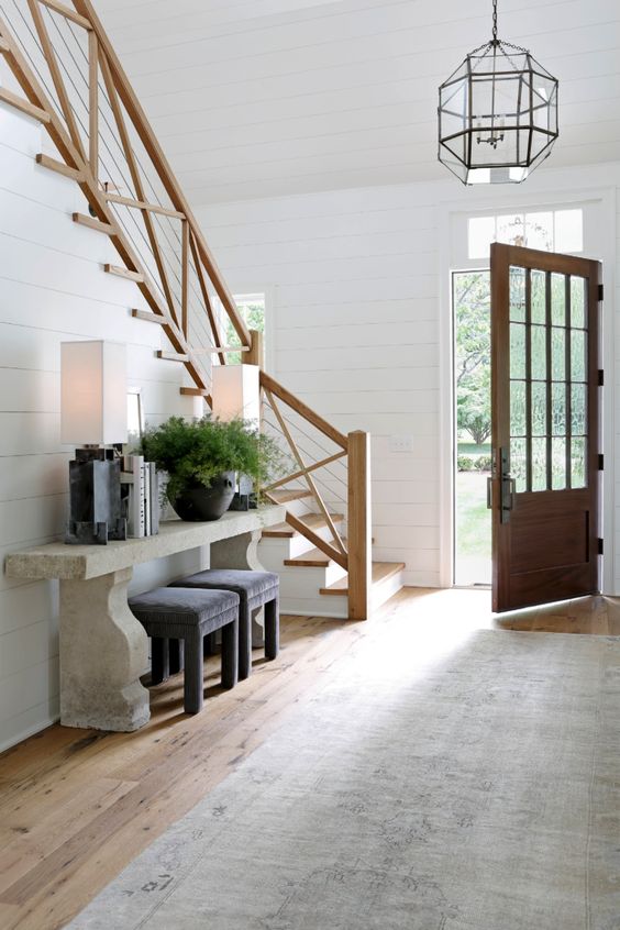 Learning more about home decor styles, like this modern farmhouse style entry way, can really help break through creative blocks in interior design