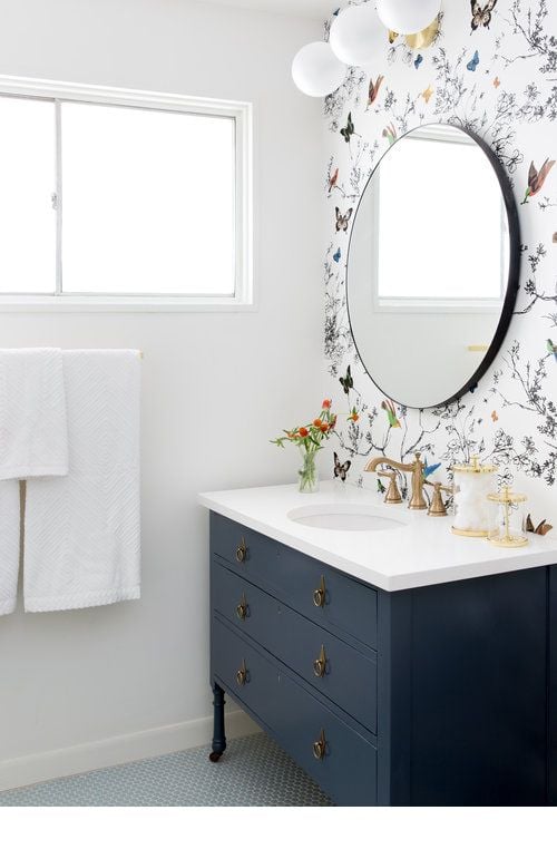 The lively and colorful wallpaper in this bathroom is a great way to brighten up the bathroom. I love how simple decor can inspire a cure to a creative block!