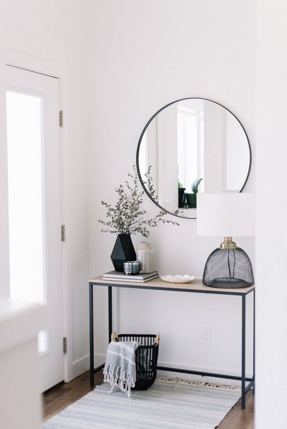 This simple home entry way is clean and modern. Looking at photos of home decor is a great way to cure a lack of creative inspiration for interior design
