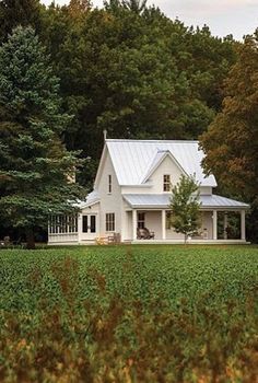 I love the farmhouse style cottage look of this home exterior!