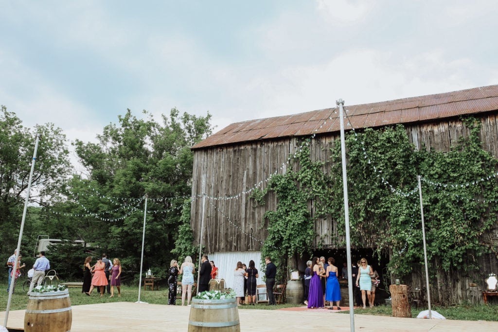 My Wedding Decor; Our outdoor wedding decor, greenery, ivory and blush florals, gold accents, rustic woods and a large barn! Rustic chic wedding reception outside! - www.nikkisplate.com