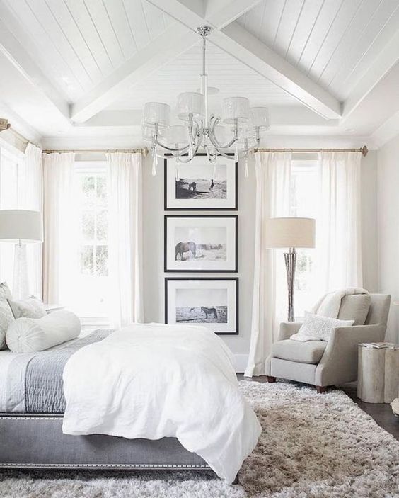 This grand master bedroom feels like it's a 5-star hotel room in your own home. I love the large framed pictures!