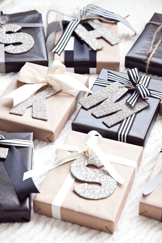 Classic black, white, and brown gift wrap with sparkling glitter letters for the perfect touch of personalization