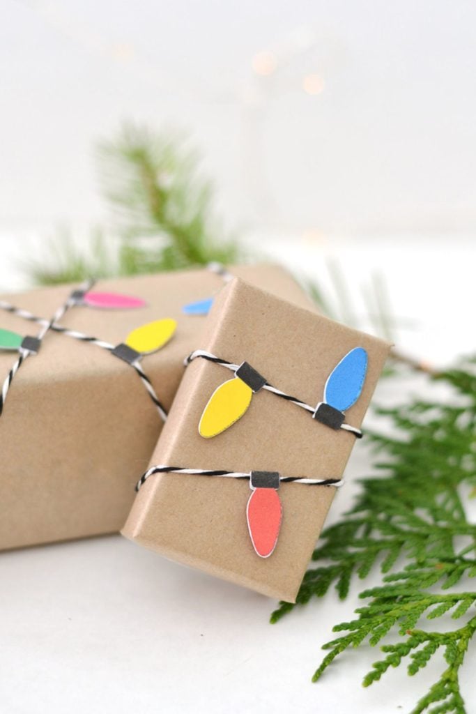 This gift wrap is simple brown paper, but the christmas lights add a nice, festive touch