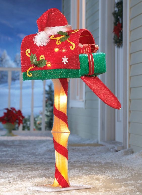 This Christmas mailbox is cute, festive, and sparkling, topped with a Santa hat