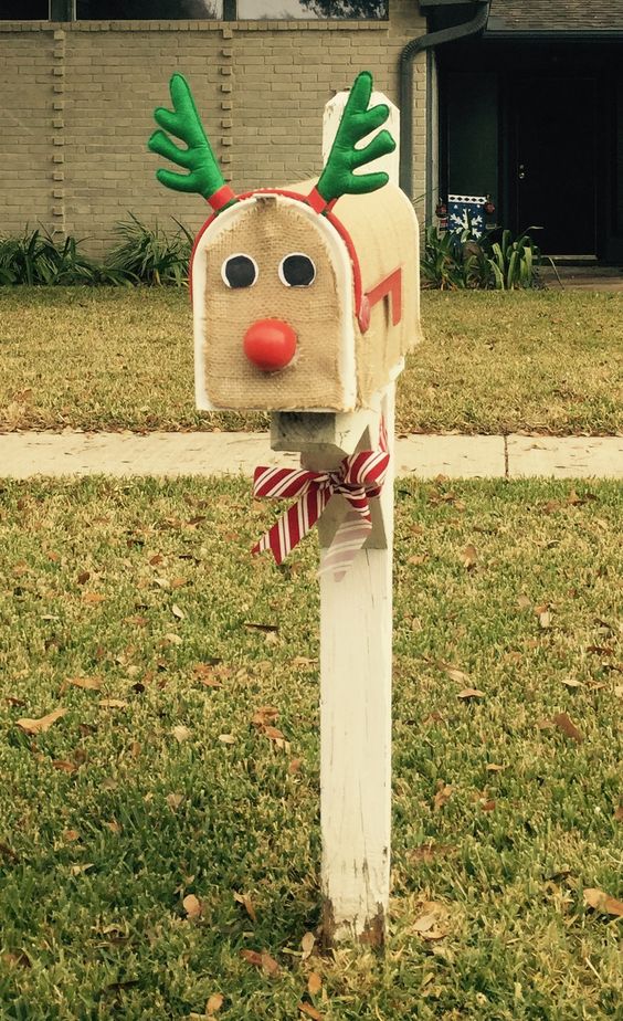 You can DIY this Christmas Mailbox to look like a reindeer with some burlap, and red nose, and a reindeer antler headband