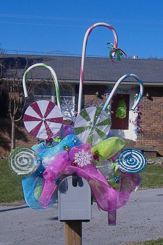 This whimsical and colorful Christmas mailbox is straight out of Candyland with lollipops and colorful candy canes