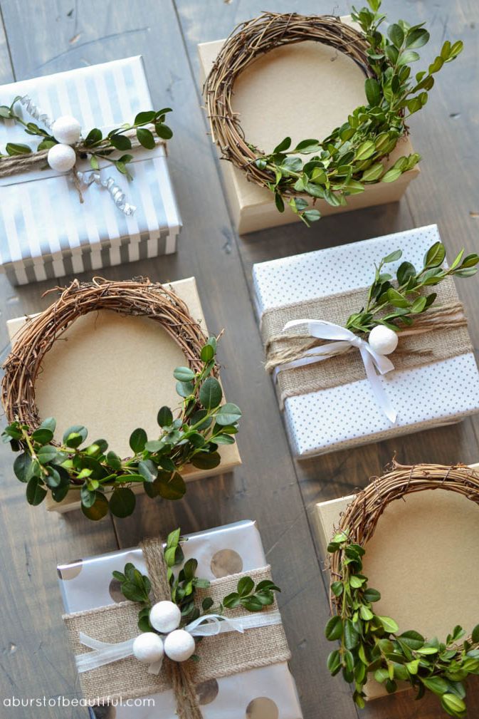 This gift wrapping is so pretty with simple-patterned wrapping paper accented with decorative rustic wreaths