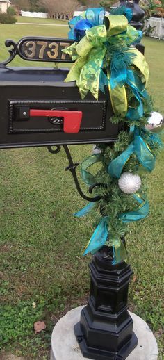 This gold and blue Christmas mailbox is subtle and simple with ribbons and ornaments