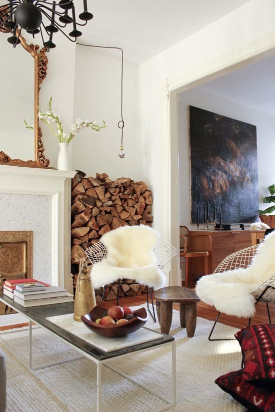 Stylish Ways To Store Wood in Your Home; cute and high style ways to hide or display wood in your home when you have a fire place or a wood burning stove. Bring on the heat and adorable piles of wood! #woodstove #fireplace #storingwood #woodpiles