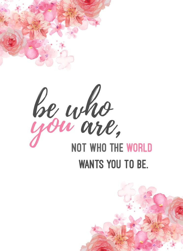 Floral wall art with pink flowers and text that reads "be who you are, not who the world wants you to be"