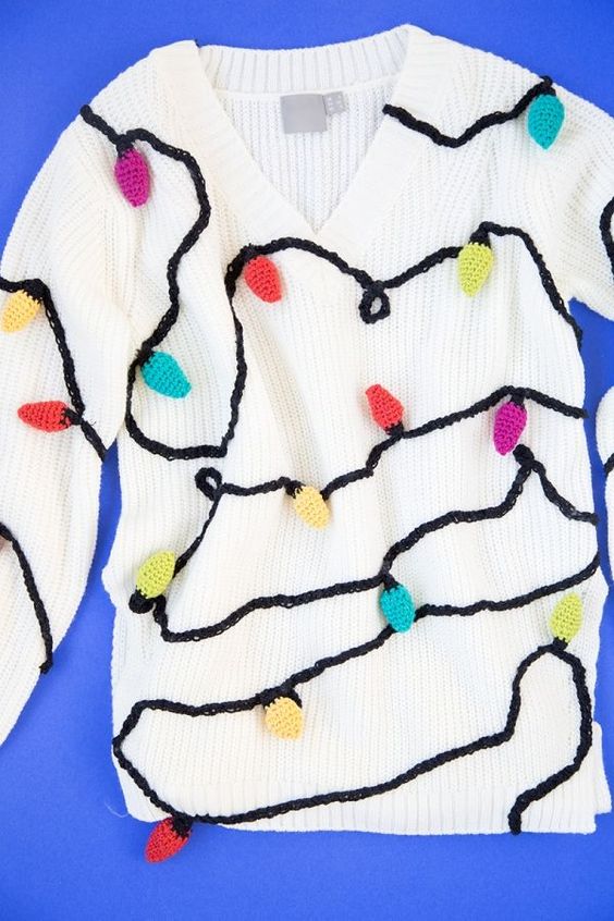 If you're a knitter, you can create the strands of Christmas lights on this ugly Christmas sweater