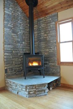 Stylish Ways To Store Wood in Your Home; cute and high style ways to hide or display wood in your home when you have a fire place or a wood burning stove. Bring on the heat and adorable piles of wood! #woodstove #fireplace #storingwood #woodpiles