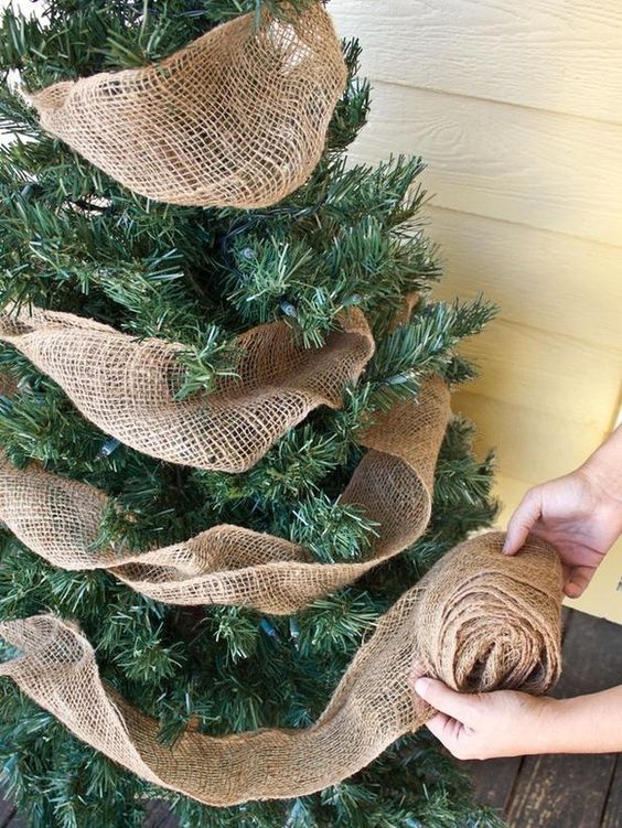 Burlap ribbon is a great way to add a rustic touch to your Christmas tree