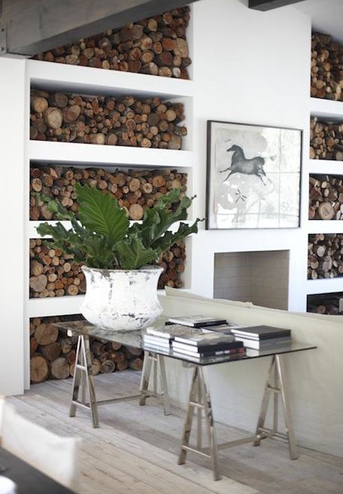 Stylish Ways To Store Wood in Your Home; cute and high style ways to hide or display wood in your home when you have a fire place or a wood burning stove. Bring on the heat and adorable piles of wood! #woodstove #fireplace #storingwood #woodpiles