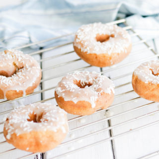 Lemon Coconut Donuts || GF and Vegan lemon coconut donuts. Soft and naturally sweetened. A healthier option to your usual morning donuts! Treat yourself to a soft, oat flour donut bursting with lemon and coconut flavours. Refined sugar free! #glutenfreedonuts #vegandonuts #donuts|| Nikki's Plate