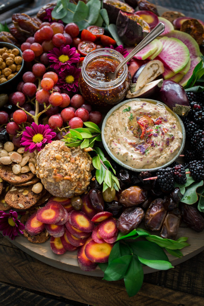 this vegan charcuterie board is packed with fresh purple color from veggies, fruits, and sweet dips and spreads