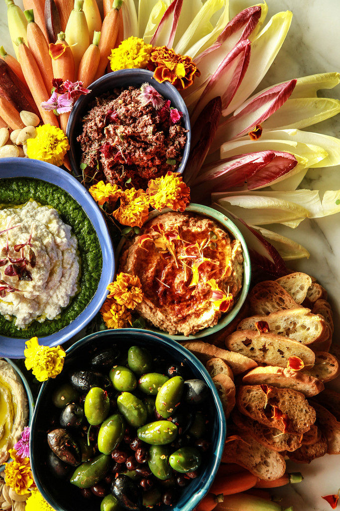 this vegan charcuterie board is packed with delicious vegan appetizers that will please the whole party