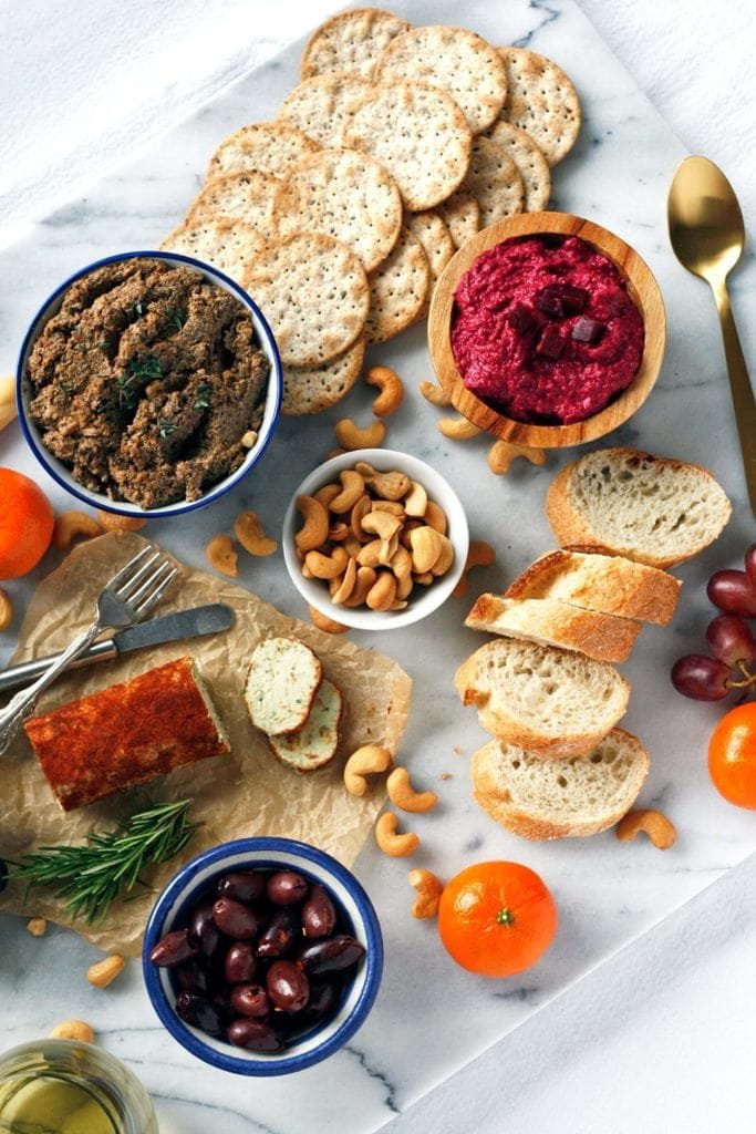 this vegan charcuterie board is perfect for Valentine's Day with light appetizers, crackers, dips, and bread