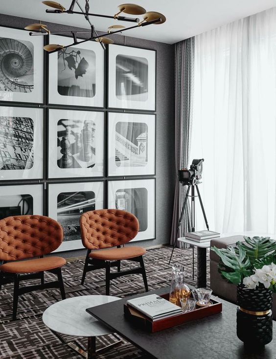 I love these large art prints on this gallery wall! The rounded corners of the frame mats really add a unique style that works with the decor in the room. 