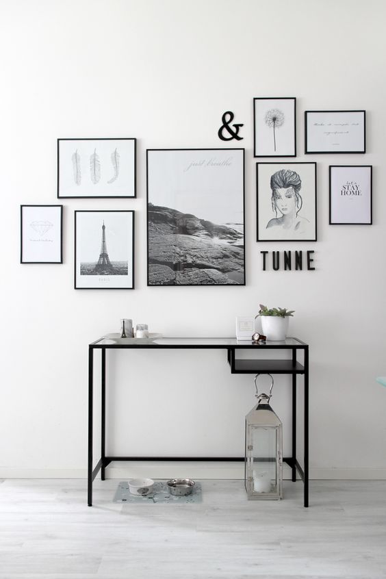 This gallery wall is a collection of lovely artwork, all in simple black frames. I love the different sizes and styles of all the pieces, making it a very personalized gallery wall!