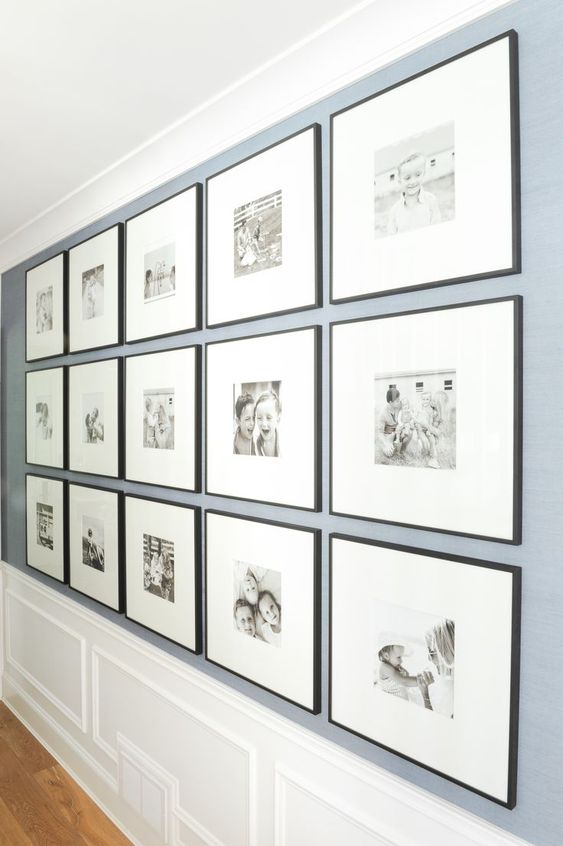 This DIY gallery wall displays precious family memories in simple black frames. The wide photo mats really bring the focus in on the pictures of the kids and family!