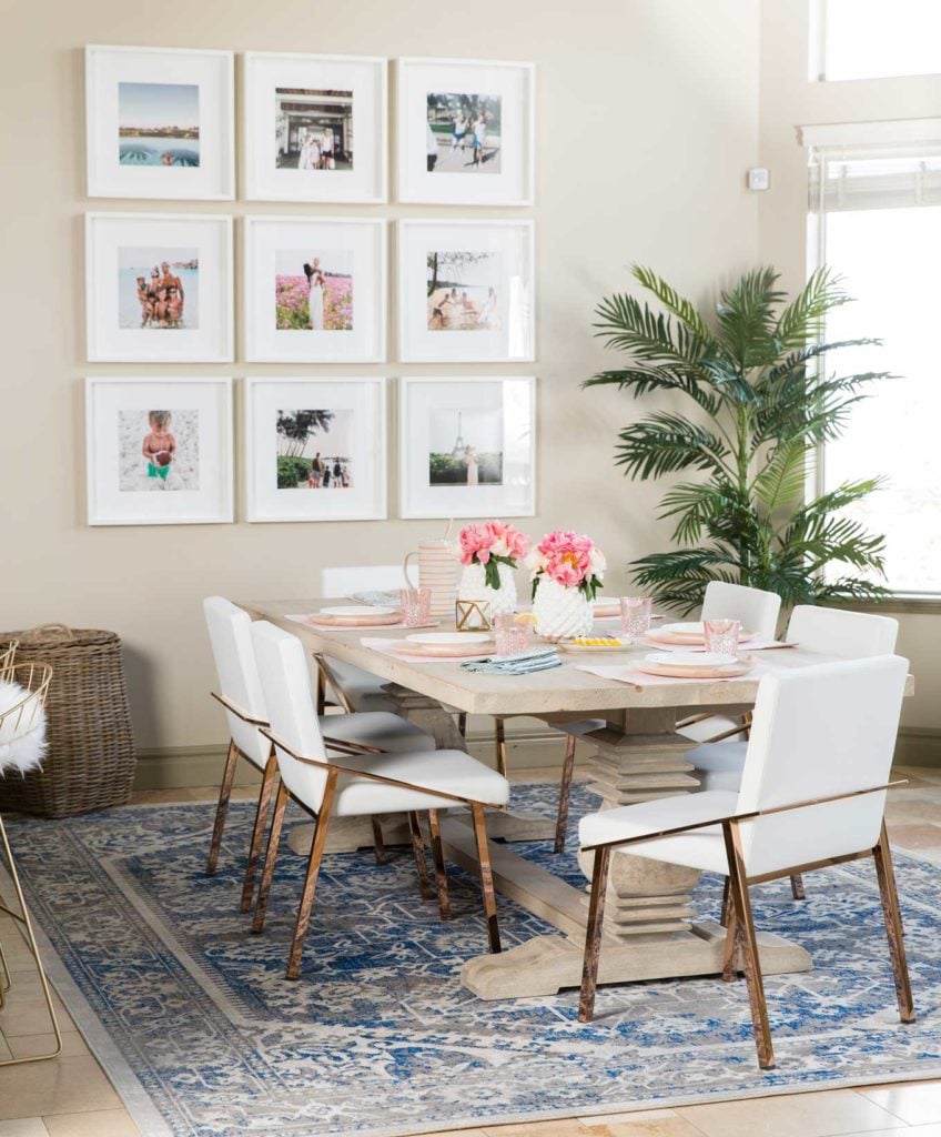 This DIY gallery wall shows off precious family memories in a simple grid. The white picture frames really bring focus to the pictures!