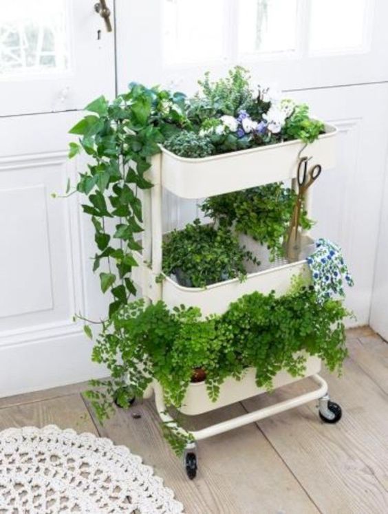 I love this rolling plant cart made from an IKEA bathroom cart.