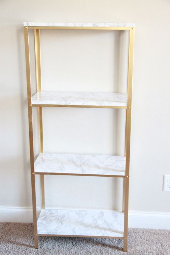 This IKEA Hylis is transformed into a stunning gold and marble shelf that's perfect for any contemporary decor home.