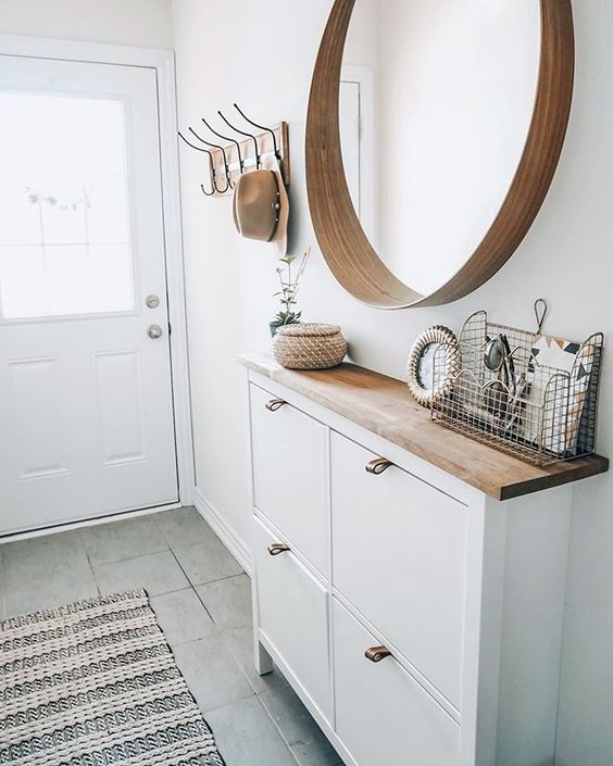 This IKEA cabinet is transformed into a perfect entryway organizer that has a hint of farmhouse style.