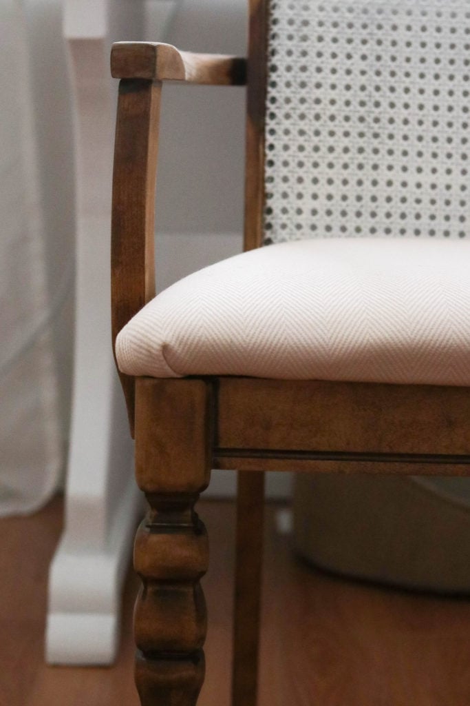 This antique office chair makeover was so easy! Here's a look at the chair after a fresh stain and new seat cover.