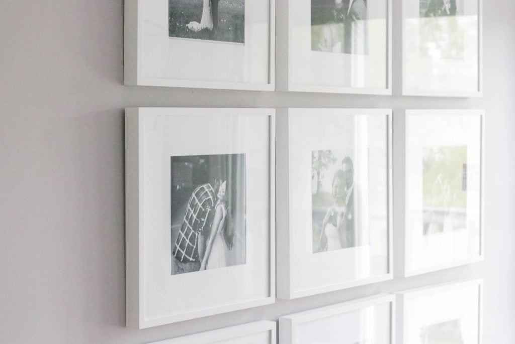 Here's how we put together a large photo gallery wall, plus super simple tips and tricks to make a gallery wall look perfect.