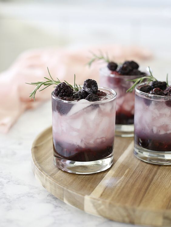 9 Fun Non-Alcoholic Mocktails - this blueberry mocktail is light and fresh, with a delightful sprig of rosemary for essence.