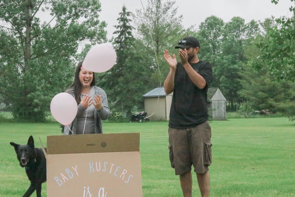 Gender Reveal Party - pink balloons flying out of box