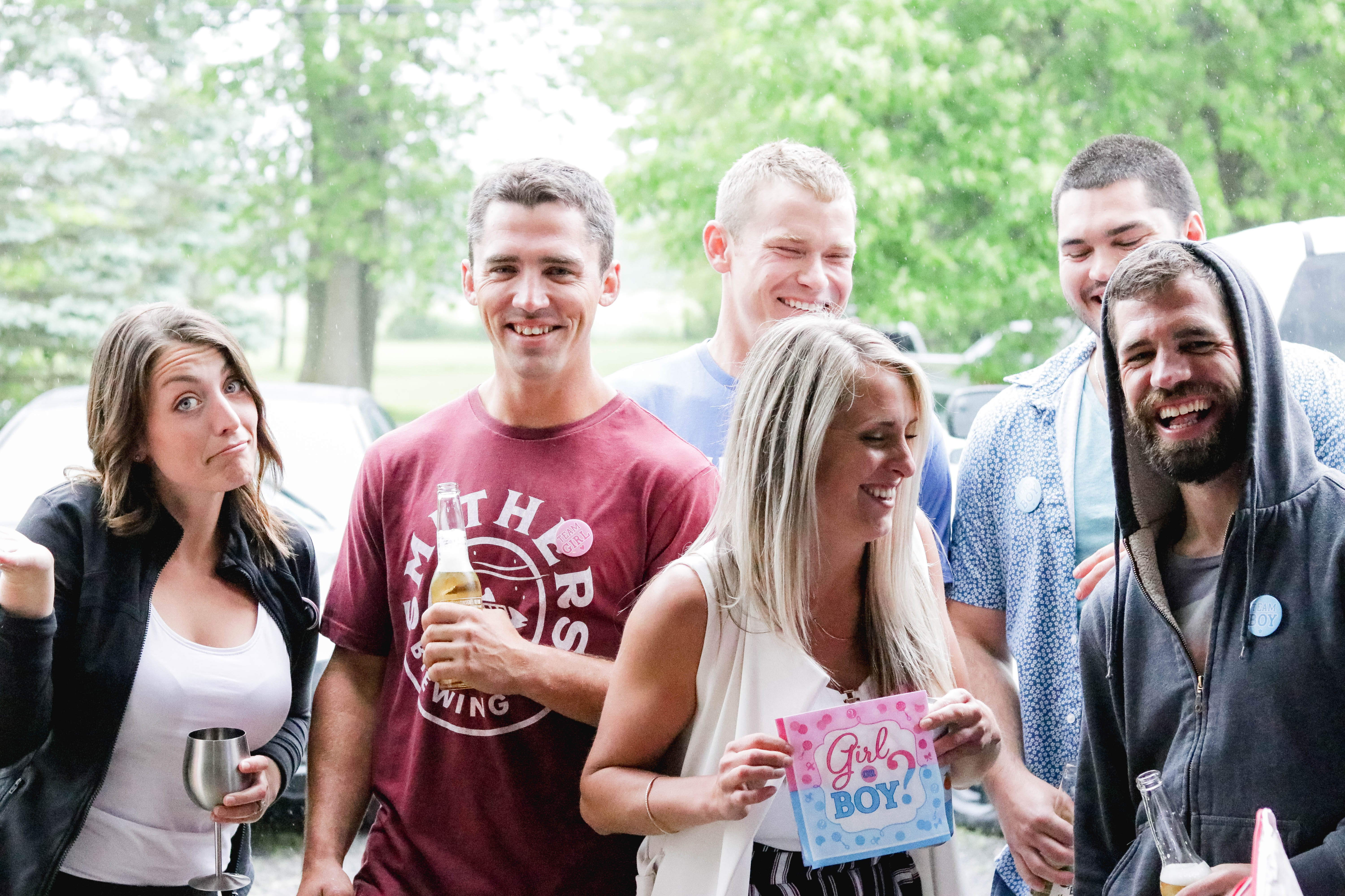 Gender Reveal Party - friends wearing badges as guess