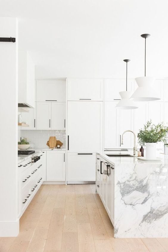 White Kitchen Designs You Haven't Seen Yet! Beautiful white kitchen inspiration for your remodel. Marble Countertop, wood bar stools, island light, island, bright white #whitekitchen #modern